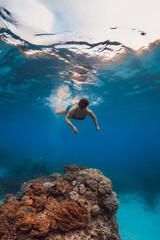 Fototapeta premium 60s woman snorkeling and diving in blue sea. Snorkeling at vacation