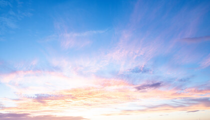 Dramatic Colorful Sunset Sky. Clouds with Sunrays. Cloudscape Sunset Background. Panorama Sky. Dramatic sky with clouds at sunset or sunrise. Sunset Sundown. Sky with colorful clouds.