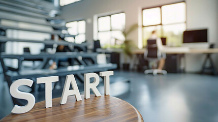 Start. Wooden letters stand on the table in office. The beginning of creation of successful product