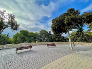 Place with wooden benches at the hill of the Castillo de la Concption, Cartagena, Spain