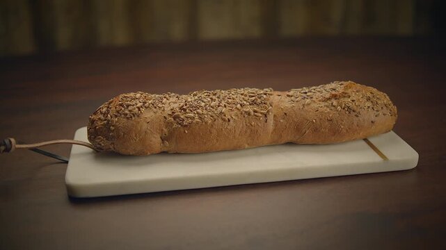 Whole Grain Baguette on Cutting Board with bakery, cuisine, fresh, savory, healthy keywords