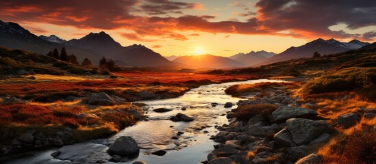 Fototapeta premium The sun sets over the valley, The last rays of light on the peaks in the wilds of the far north