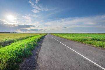 Fototapeta premium A long road with a clear blue sky and no clouds