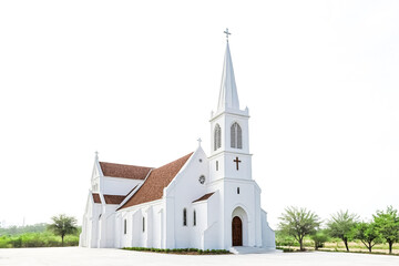Fototapeta premium White Church with Tall Steeple and Cross