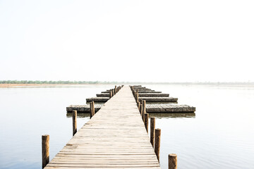 Fototapeta premium Wooden path leading to the horizon