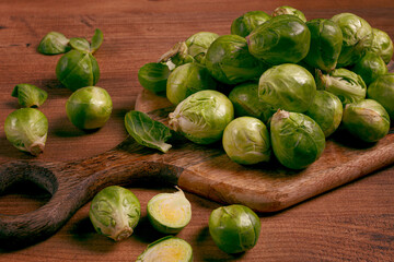 fresh Brussels sprouts, raw, top view, on a wooden table, no people,