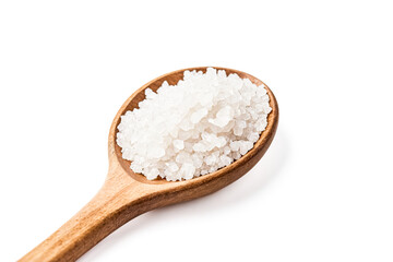 Close-up of a wooden spoon filled with white salt crystals