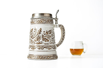 Ornate Beer Stein and Glass on White Background