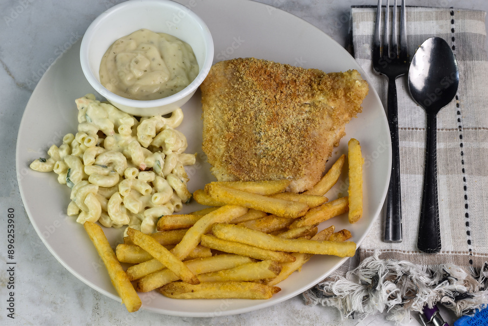 Wall mural baked haddock with macaroni salad and french fries