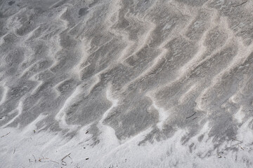 Sand texture on the bank of the mountain river Panj in Pamir