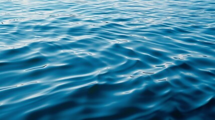 Fototapeta premium Calm blue sea water, focusing on its texture and gentle ripples