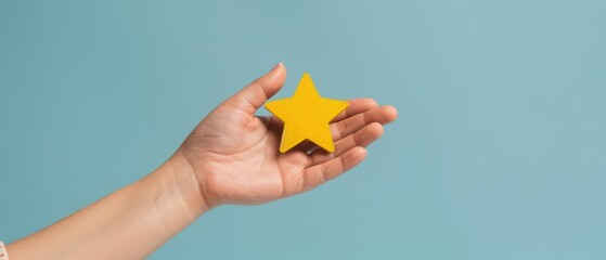 Fototapeta premium A hand proudly presenting a gold star for outstanding customer satisfaction, banner, with copy space