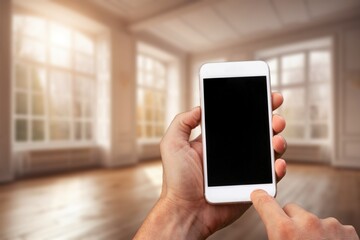 Business man using phone at home
