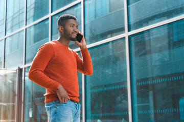 Man Talking On Phone Outside Modern Building