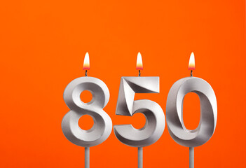 Candle number 850 - Birthday in orange background