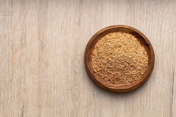 Soy fiber to cleanse the colon with psyllium in the bowl​ - wooden background