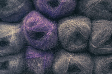 Several skeins of colored yarn. Fluffy plush yarn in cozy colors. Crocheting and knitting. A calm...