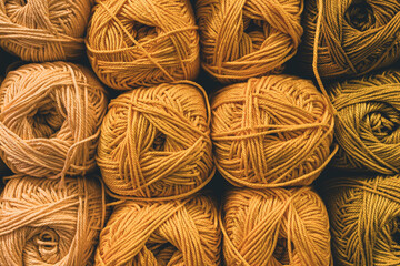 Several skeins of colored yarn. Fluffy plush yarn in cozy colors. Crocheting and knitting. A calm...