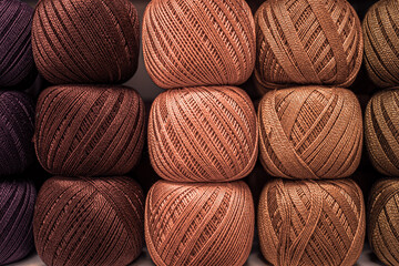 Several skeins of colored yarn. Fluffy plush yarn in cozy colors. Crocheting and knitting. A calm...