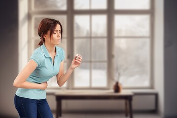 Fototapeta premium Woman suffering from menstrual pain at home
