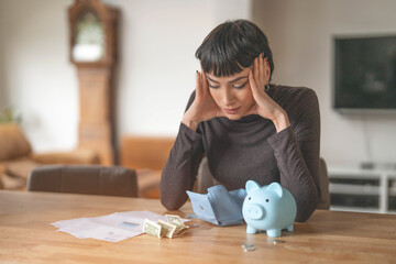 Woman Stressed About Finances While Looking at Bills