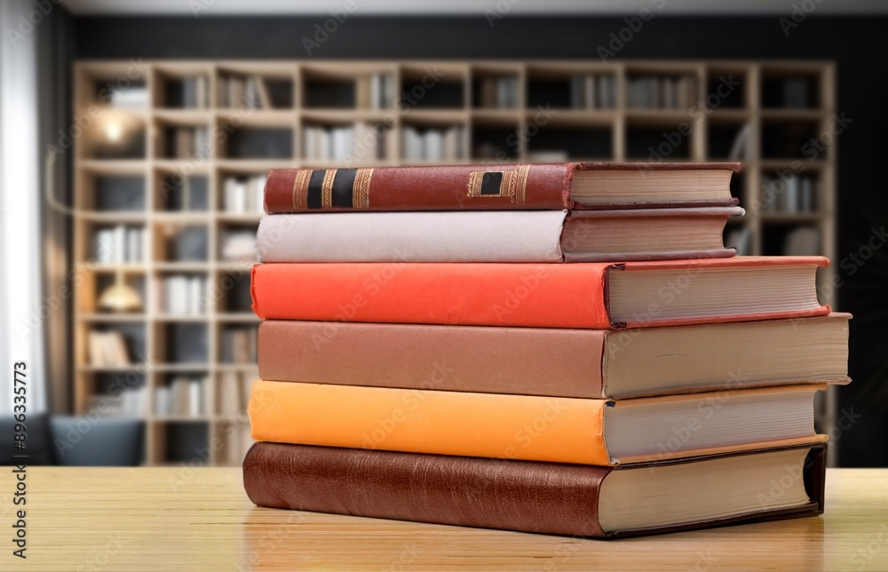 Wall mural stack of reading books at library background