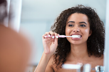Woman, mirror and brushing teeth for hygiene with wellness, fresh breath and dental routine in...