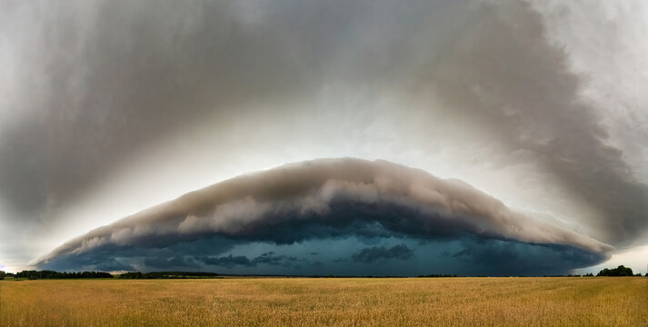 Super shelf, arcus storm clouds over the fields in summer