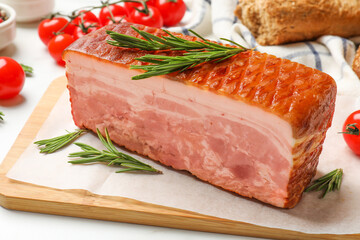 Piece of raw bacon, rosemary and tomatoes on white table, closeup