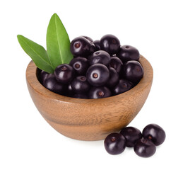 Fresh ripe acai berries in bowl and green leaves isolated on white