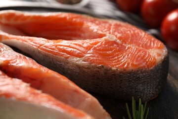 Fresh salmon steaks on table, closeup view