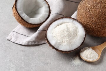 Organic coconut flour and fresh fruits on light grey table