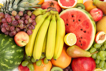 Many fresh ripe fruits as background, top view