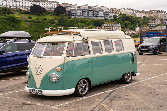Ilfracombe, Devon, UK - June 24 2024. Vintage and retro VW camper van in the Ilfracombe harbour public pay and display car park