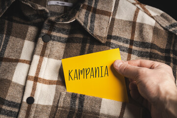 Yellow card with a handwritten inscription 