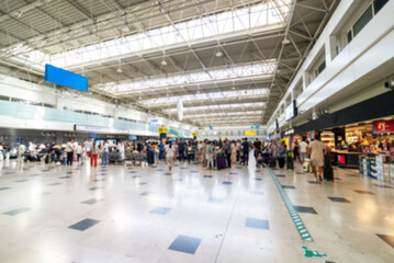 Many passengers at the airport. Blurred image. Suitable for background.