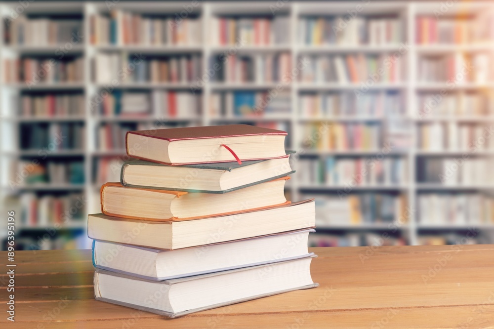 Wall mural stack of reading books at library background