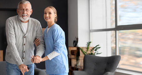 Senior man with stick and nurse at home
