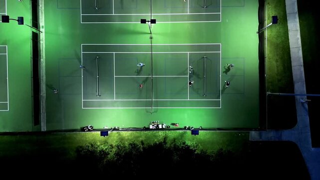 night time pickleball courts with high slow pulling forward movement