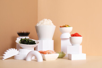 Composition with tasty Chinese food and plaster decor on color background
