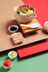 Composition with delicious Chinese food on color background