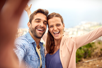 Obraz premium Couple, portrait and selfie with celebration for love, care and happiness together in summer. Man, woman and Italy adventure for profile picture, honeymoon and romantic date or vacation view to relax