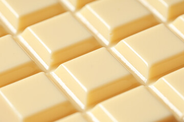 Tasty white chocolate as background, closeup