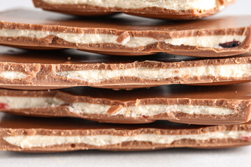 Stack of tasty chocolate pieces, closeup