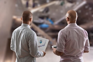 Engineer and Scientist Standing at Factory Facility