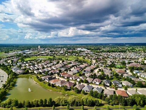 Aerial View of Sprawling Suburb in Naperville, Illinois with Pond  