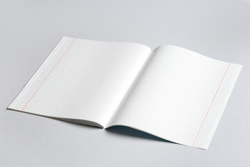 Open copybook with blank pages on grey background