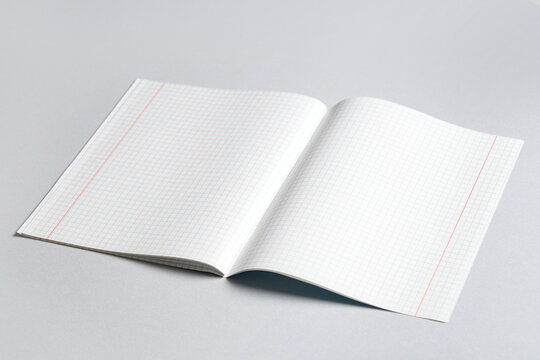 Open copybook with blank pages on grey background