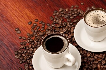 Cup of tasty hot coffee on wooden desk