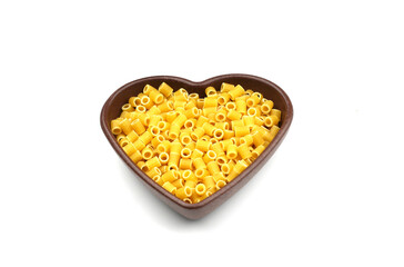 Pasta in the shape of a heart on a white background.